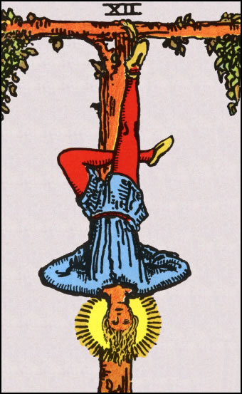 The Hanged Man Tarot Card depicting a man hanging upside down from a tree